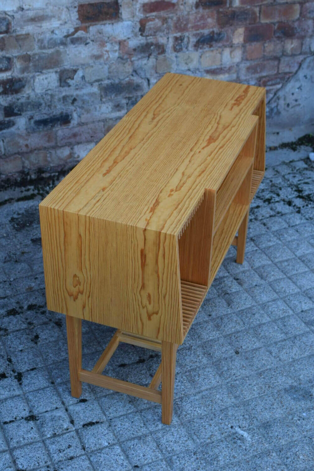 Commissioned Bespoke Handmade Turntable Credenza Book matched Pitch Pine following the contours of this handmade Credenza for turntables and vinyl records. Made by Fundi Joinery in Scotland